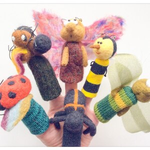 May include: Set of six finger puppets featuring various insects, including a ladybug, a bee, a butterfly, and a spider. The puppets are made of felt and have bright colors and whimsical designs.