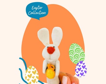 Easter Bunny finger wool puppet, holding a funny Easter egg.