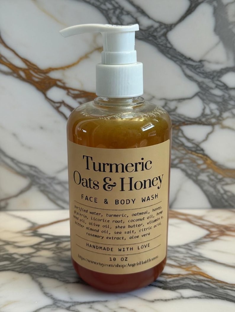 May include: A clear bottle of Turmeric Oats & Honey Face & Body Wash with a white pump dispenser. The label includes the product name, ingredients, and the text "HANDMADE WITH LOVE". The bottle contains approximately 295 ml of product.