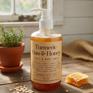 May include: A clear bottle of Turmeric Oats & Honey Face & Body Wash with a white pump dispenser. The label includes the ingredients and the text "HANDMADE WITH LOVE". A small honeycomb and a potted plant are next to the bottle. The bottle contains 295 ml of product.