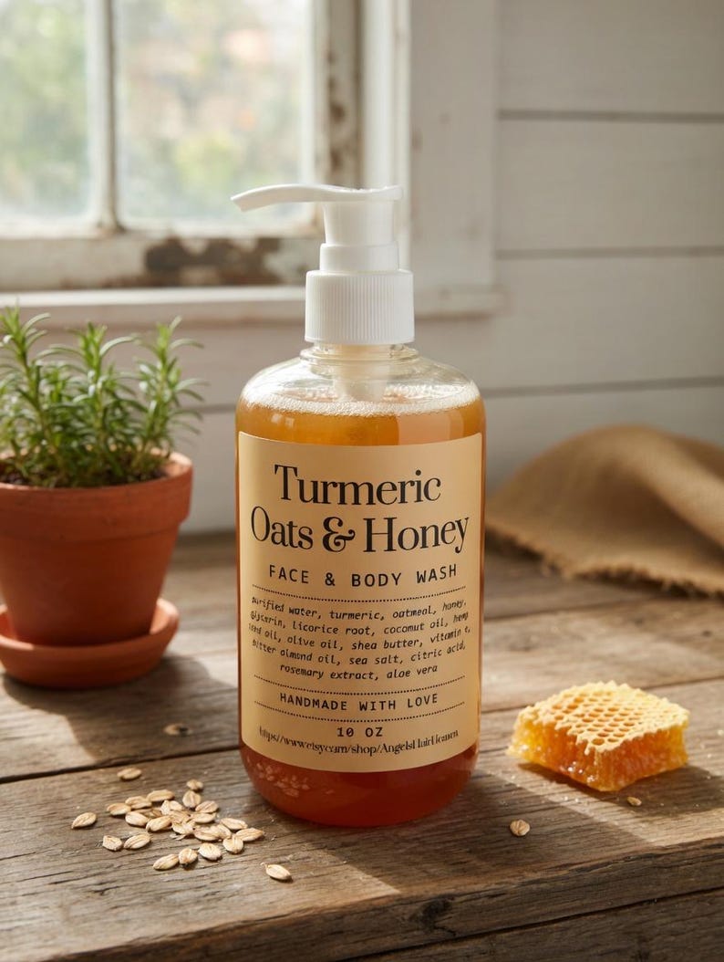 May include: A clear bottle of Turmeric Oats & Honey Face & Body Wash with a white pump dispenser. The label includes the ingredients and the text "HANDMADE WITH LOVE". A small honeycomb and a potted plant are next to the bottle. The bottle contains 295 ml of product.