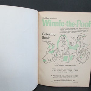 May include: Winnie-the-Pooh colouring book cover featuring illustrations of Winnie-the-Pooh, Piglet, Eeyore, Tigger, and Owl. The book is an authorised edition and includes a colour code for the pictures.
