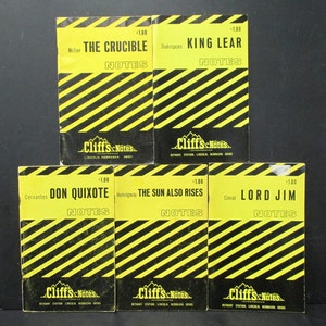 May include: Five yellow and black striped paperback books with the title "Cliffs Notes" on the front cover. The titles of the books are "The Crucible", "King Lear", "Don Quixote", "The Sun Also Rises", and "Lord Jim".