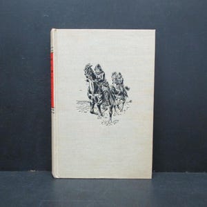 May include: Black and white illustration of two people on horseback riding through a field. The people are wearing cloaks and hats. The horses are detailed with saddles and bridles.