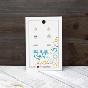 May include: A white card with four pairs of silver earrings, each marked with "CTR." The card features the text "CHOOSE THE Right" in blue and a colorful star and circle design. The Ringmasters jewelry and gifts logo is at the bottom.