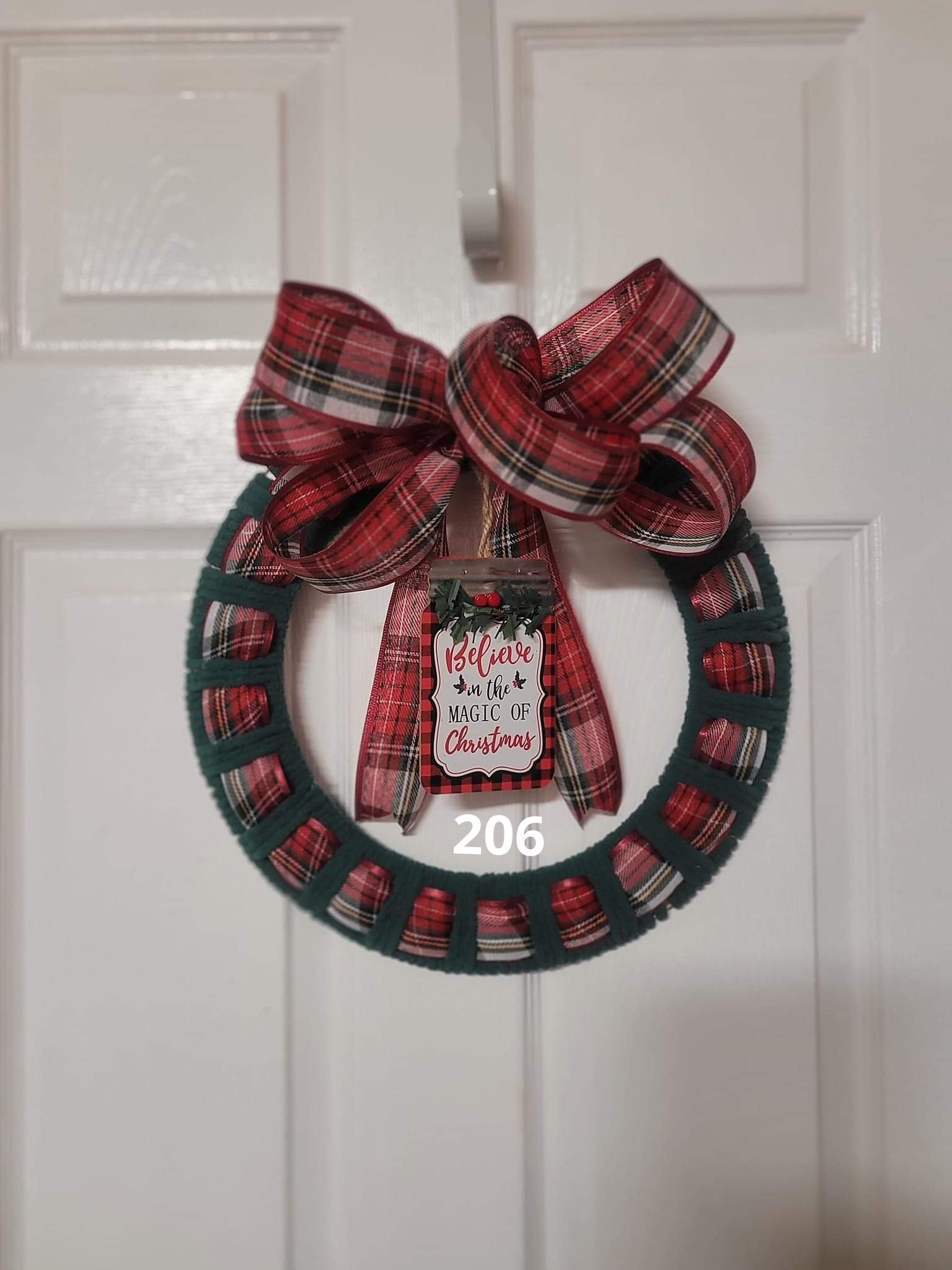 16 Cozy Christmas Wreaths to Welcome the Season 10 Christmas Wreath, yarn and ribbon