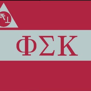 May include: A red and white flag with a white triangle at the top. Inside the triangle is a red circle with the text "下L" in white. Below the triangle is a white stripe with the text "ΦΣΚ" in red.