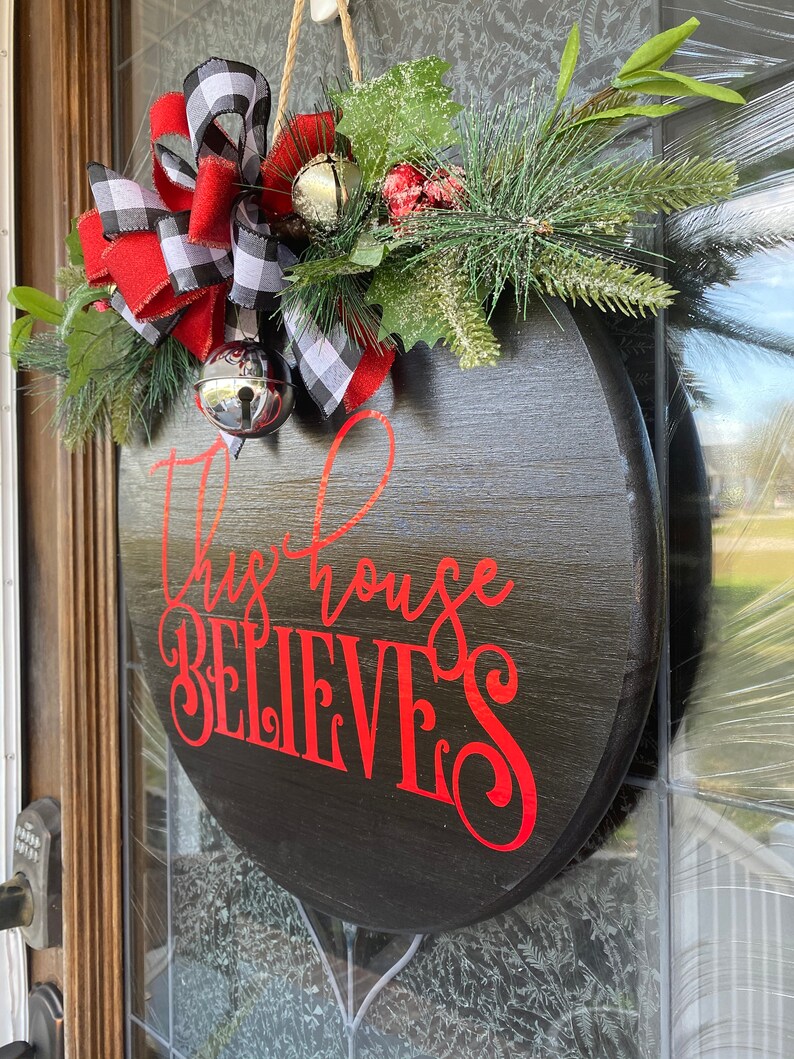 Christmas Door Hanger Christmas Wreath This House Believes Etsy
