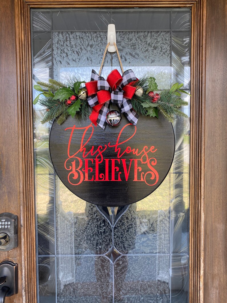 Christmas Door Hanger Christmas Wreath This House Believes Etsy