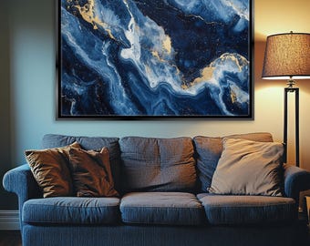 May include: Abstract art print featuring a blue and gold marble design. The print is framed in a black frame and is hanging on a wall above a blue couch.