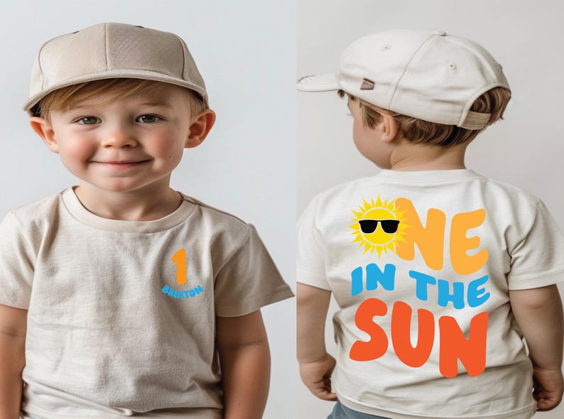 May include: A beige short-sleeved t-shirt and a matching beige baseball cap. The front of the shirt features the number 1 in orange and the name Brixton in blue. The back displays a yellow sun with sunglasses and the text ONE IN THE SUN.