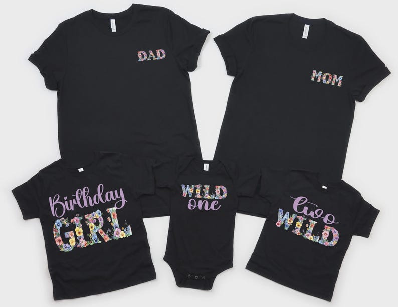 May include: A set of five black garments including two adult t-shirts with floral DAD and MOM text, a child t-shirt with Birthday GIRL text, a baby bodysuit with WILD one text, and a child t-shirt with two WILD text in floral patterns.