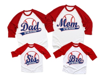 May include: Four baseball-themed shirts with red and white sleeves. The shirts say "Dad of the Rookie", "Mom of the Rookie", "Sis of the Rookie", and "Bro of the Rookie".