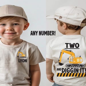 May include: A beige short-sleeved t-shirt featuring a small yellow excavator graphic and the name LYON on the front. The back displays a large yellow excavator graphic with the text TWO AND DIGGIN IT! above a yellow and black striped border.