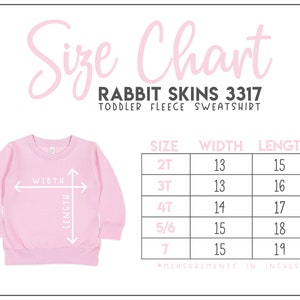 May include: Size chart for a toddler fleece sweatshirt, showing measurements in inches for width and length. Sizes include 2T, 3T, 4T, 5/6, and 7. The chart is labeled "Rabbit Skins 3317 Toddler Fleece Sweatshirt".