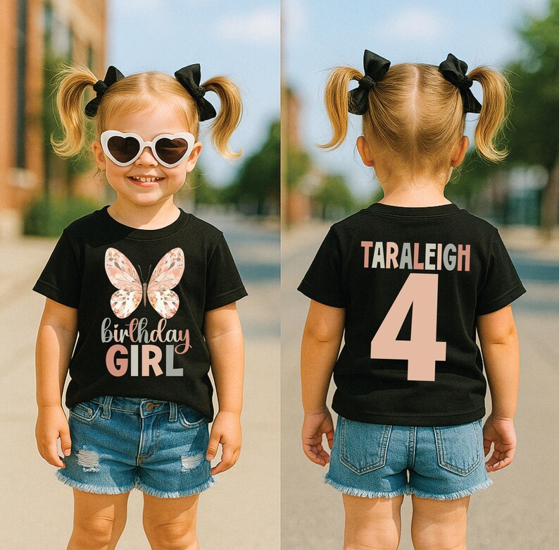 May include: A black t-shirt featuring a butterfly design and the text "birthday GIRL" in pink. The back of the shirt displays the name "TARALEIGH" and the number "4" in pink. The child is wearing denim shorts and heart-shaped sunglasses.