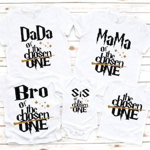 May include: Set of five white t-shirts with black text and a gold wand graphic. The shirts read "DaDa of the chosen ONE", "MaMa of the chosen ONE", "Bro of the chosen ONE", "Sis of the chosen ONE", and "the chosen ONE".