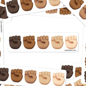 May include: Five raised fists in different skin tones, each with a white outline. The fists are arranged in a row on a white background. The text "onpointpins.com" appears at the bottom of the image.