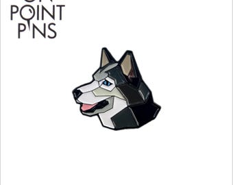 May include: A geometric design pin featuring a husky dog head with black, white, and gray colors. The pin has blue eyes and a pink tongue. The text "ON POINT PINS" is at the top, with "onpointpins.com" and an Instagram handle at the bottom.
