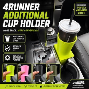 May include: A lime green 3D printed plastic cup holder insert designed for a Toyota 4Runner 2010+ vehicle. The accessory fits into the existing centre console cup holder to provide additional space for a beverage container with a straw.