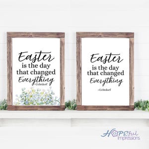 May include: Two framed prints with a white background and black text that reads "Easter is the day that changed Everything - Uchtdorf". The print on the left has a watercolour illustration of blue flowers. The prints are framed in rustic brown wood.