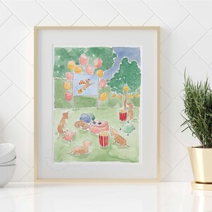 May include: Watercolour print depicting a dog party. Dachshunds are gathered around a pink bowl, with balloons and a movie screen. The artwork is framed in a light wood frame and set against a white tile background.