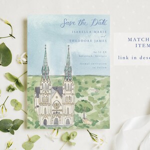 May include: Save the Date card with a watercolor illustration of a church with two tall spires. The text reads "Save the Date", "Isabella Marie & Theodore James", "08.12.XX", "Savannah Georgia", and "Formal invitation to follow".