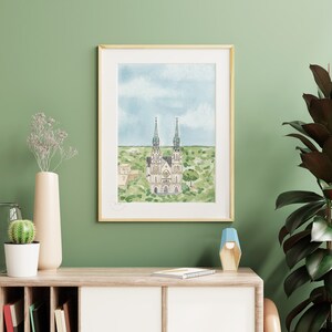 May include: A watercolor painting of a church with two tall spires, surrounded by green trees and a blue sky with white clouds.