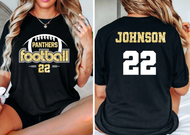 May include: Black t-shirt with gold glitter text. The front of the shirt says "Panthers Football 22" with a football graphic. The back of the shirt says "JOHNSON 22".