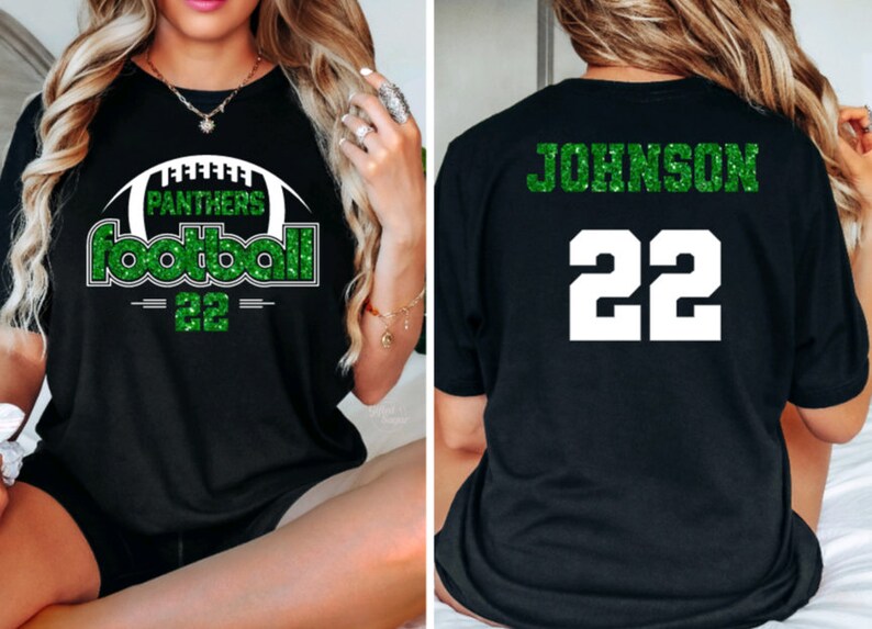 May include: Black t-shirt with green glitter text and a football graphic. The front of the shirt says "Panthers Football 22". The back of the shirt says "Johnson 22".