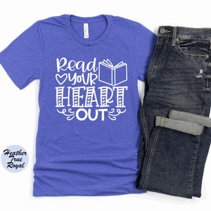 May include: A royal blue t-shirt with the text "Read Your Heart Out" in white. The text includes a heart and a book graphic.