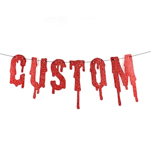 May include: Red glitter "CUSTOM" banner with dripping letters. The banner is strung on black thread.