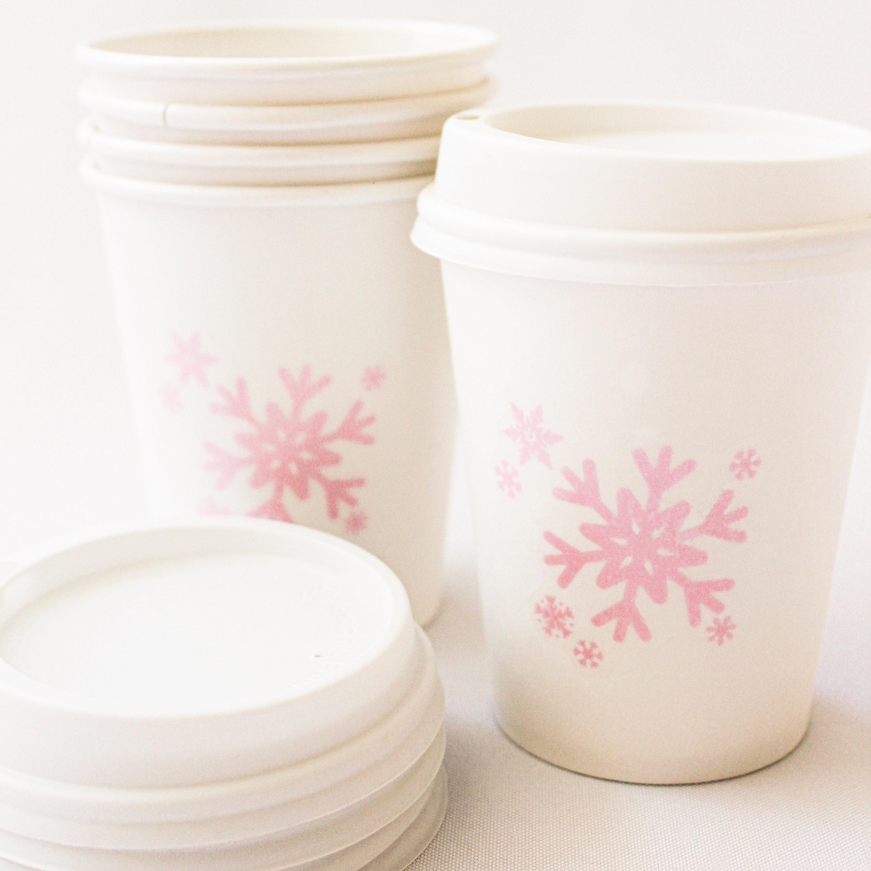 Winter and Christmas Drinks in Disposable Cups with Black Lids