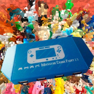 May include: A blue USB hub shaped like a Nintendo Wii U console with the text "MaxGear Cross Fight 2.0" printed on the front. The hub has four USB ports on the bottom.