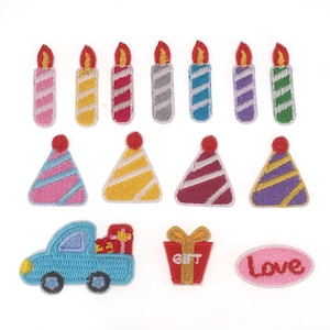 May include: A set of 15 iron-on patches featuring birthday party themes. The patches include candles, party hats, a truck carrying a gift box, and a heart with the word "Love".