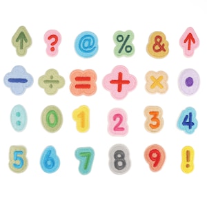 May include: A collection of colorful, embroidered patches featuring numbers, mathematical symbols, and punctuation marks. The patches are in various colors, including green, blue, pink, and orange, with a textured, stitched appearance. The set includes numbers 0-9, plus symbols.