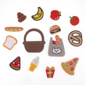 May include: A set of 13 embroidered iron-on patches featuring various food and drink items, including a banana, a hamburger, a watermelon slice, a pizza slice, a pretzel, a basket, a loaf of bread, a bag of groceries, a gift box, an ice cream cone, a tomato, an apple, and a pile of poop.