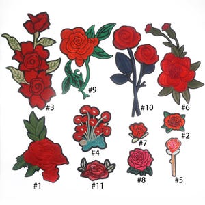 May include: Eleven embroidered iron-on patches featuring red roses in various styles. The patches are numbered 1 through 11.