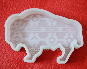 May include: White silicone mold shaped like a buffalo with a geometric pattern inside.