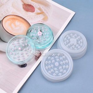May include: Two clear plastic grinder molds with a diamond pattern and a white silicone grinder mold with a diamond pattern. The molds are for making resin crafts.