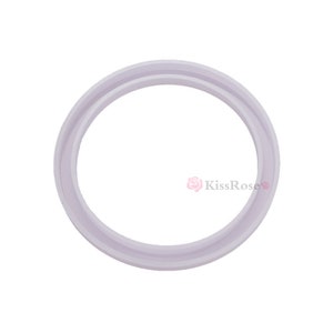 May include: A white silicone ring with a smooth, rounded surface. The ring has a double lip design.