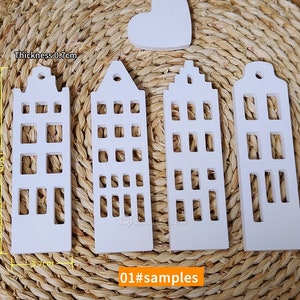 May include: Four white wooden house-shaped ornaments with cut-out windows. The ornaments are 13 cm tall and 3.7 cm wide. The thickness is 0.7 cm. 01#samples