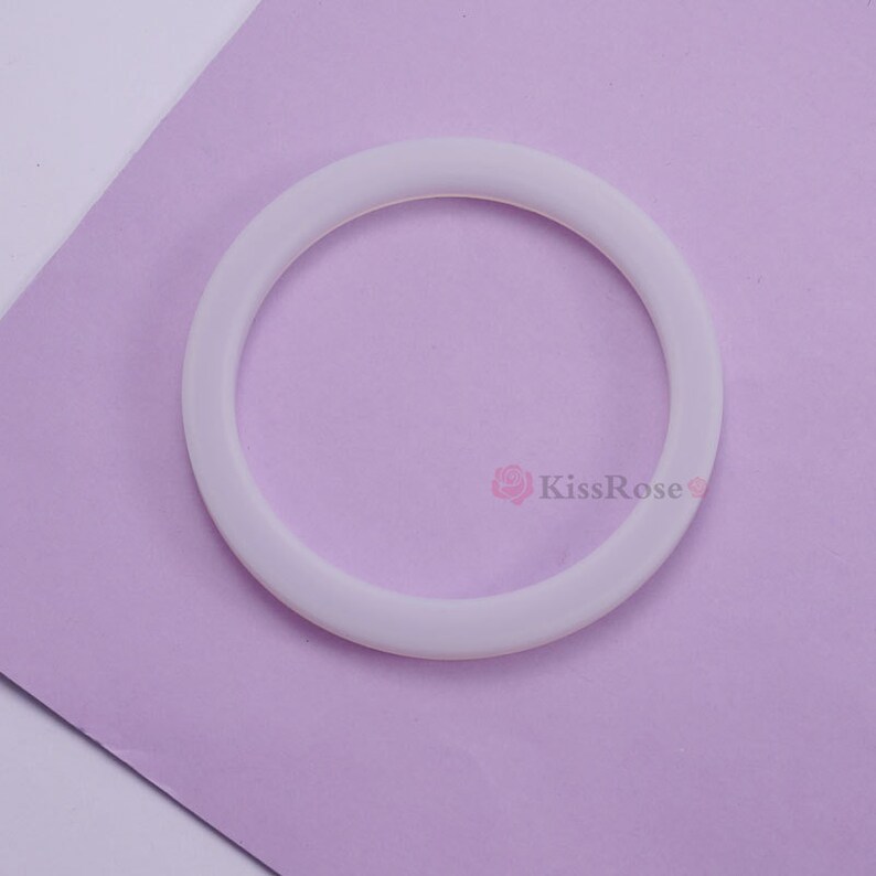 May include: A white silicone ring, likely used for a coffee maker or other kitchen appliance.