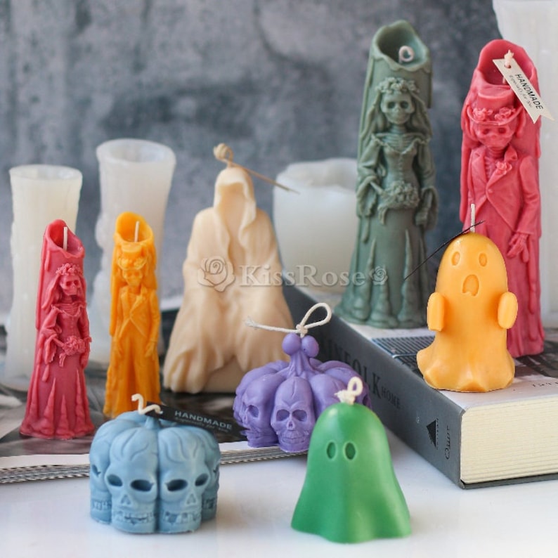 May include: Assortment of Halloween themed candles, including a ghost, a skeleton bride, a skeleton groom, a skull pumpkin, and a reaper. The candles are made of wax and are hand-painted with intricate details.
