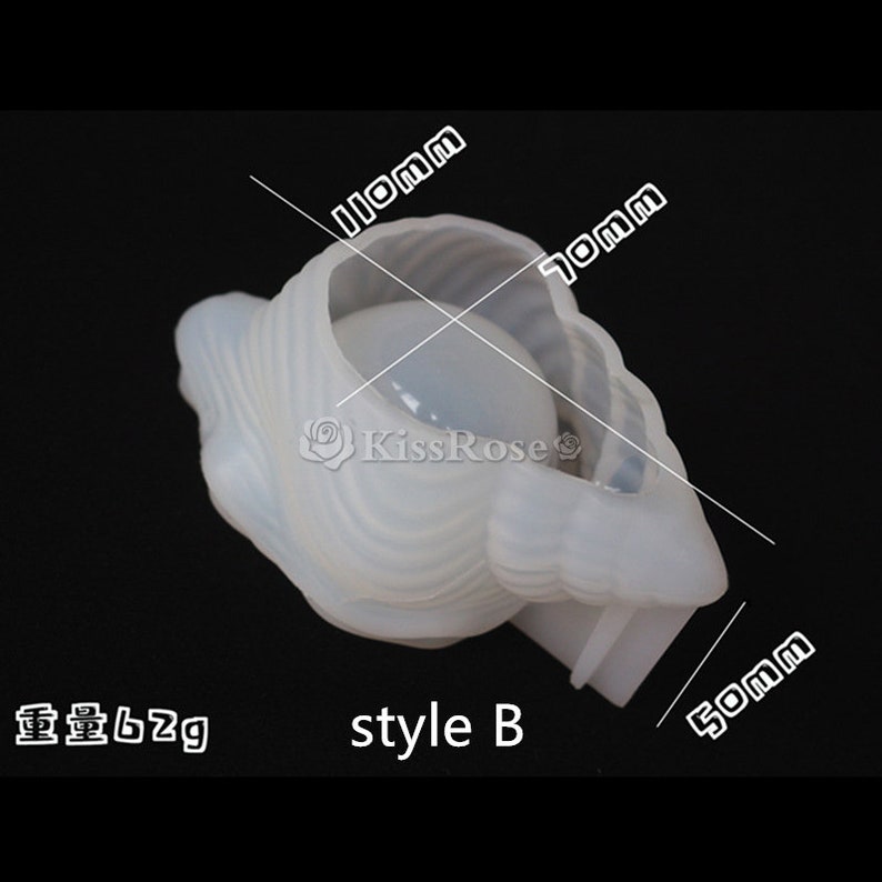 以下が含まれることがあります： 貝殻の形をした白いシリコンモールド。開口部は2.8cm&times;1.8cm。モールドの長さは5cm。モールドの下に「style B」の文字が印刷されています。