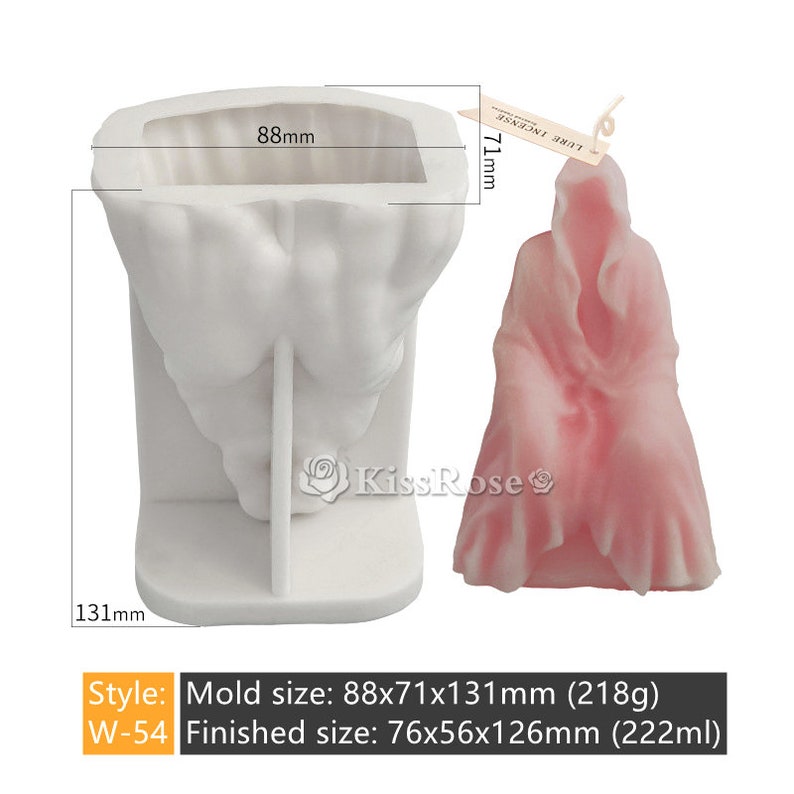 May include: White silicone mold for making a candle in the shape of a hooded figure. The mold is 88mm wide, 71mm deep, and 131mm tall. A finished candle is shown next to the mold. The candle is pink and has a hooded figure shape. The candle is 76mm wide, 56mm deep, and 126mm tall.