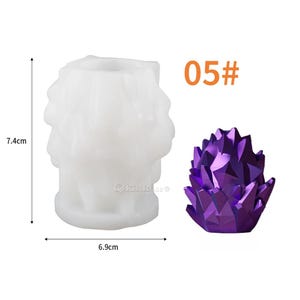 May include: A white silicone mold for making a crystal-shaped candle. The mold is 7.4 cm tall and 6.9 cm wide. A purple crystal candle is shown next to the mold. The text "05#" is printed on the image.