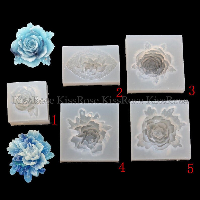 May include: Five silicone molds for making resin crafts. The molds are shaped like different types of flowers, including roses and peonies. The molds are white and have a smooth surface.