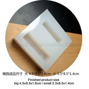 May include: White silicone mold with two rectangular cavities. The mold is for making soap bars. The finished product size is 4.5 inches by 9.5 inches by 1.6 inches for the large bar and 3.3 inches by 8.5 inches by 1.4 inches for the small bar.