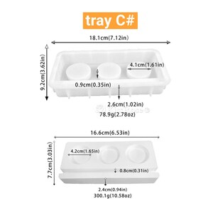 Puede incluir: Dos moldes de silicona blancos para hacer jabones o velas redondas. El molde m&aacute;s grande mide 16,6 cm de ancho y 7,7 cm de alto. El molde m&aacute;s peque&ntilde;o mide 18,1 cm de ancho y 9,2 cm de alto. Ambos moldes tienen una etiqueta con la leyenda tray C#.